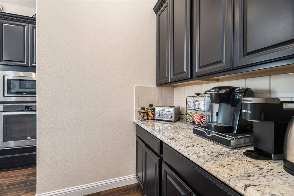 Kitchen includes butler's pantry with additional cabinet/storage space
