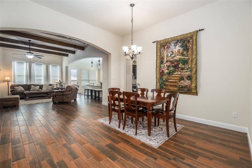 Large formal dining area with entry into kitchen and main living area