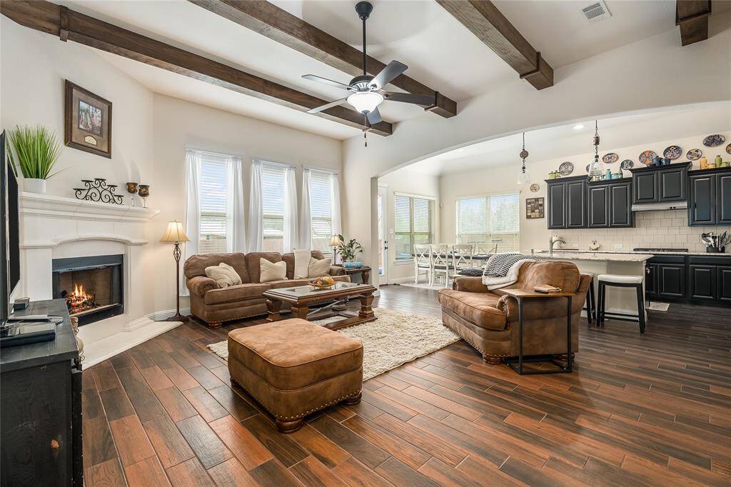 Beautiful wood beams run the length of the family room