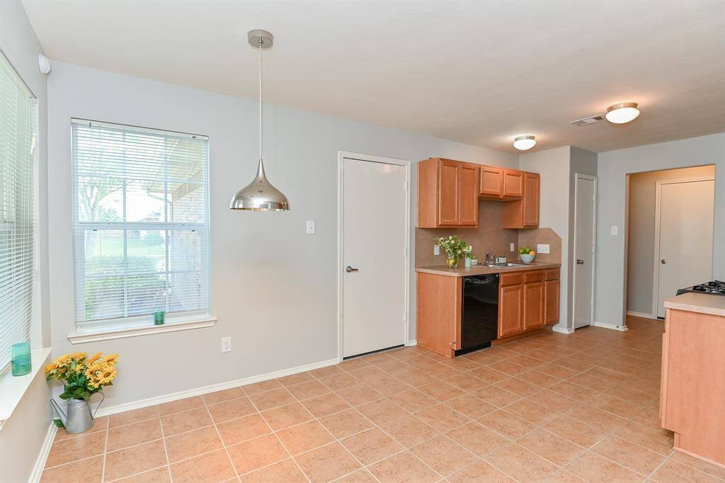 Bright and inviting kitchen with ample space for family breakfasts.