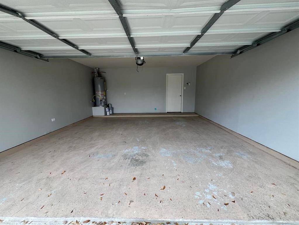 Spacious garage with automatic door opener.