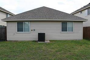 Spacious backyard featuring a high-efficiency Trane AC unit for optimal comfort.