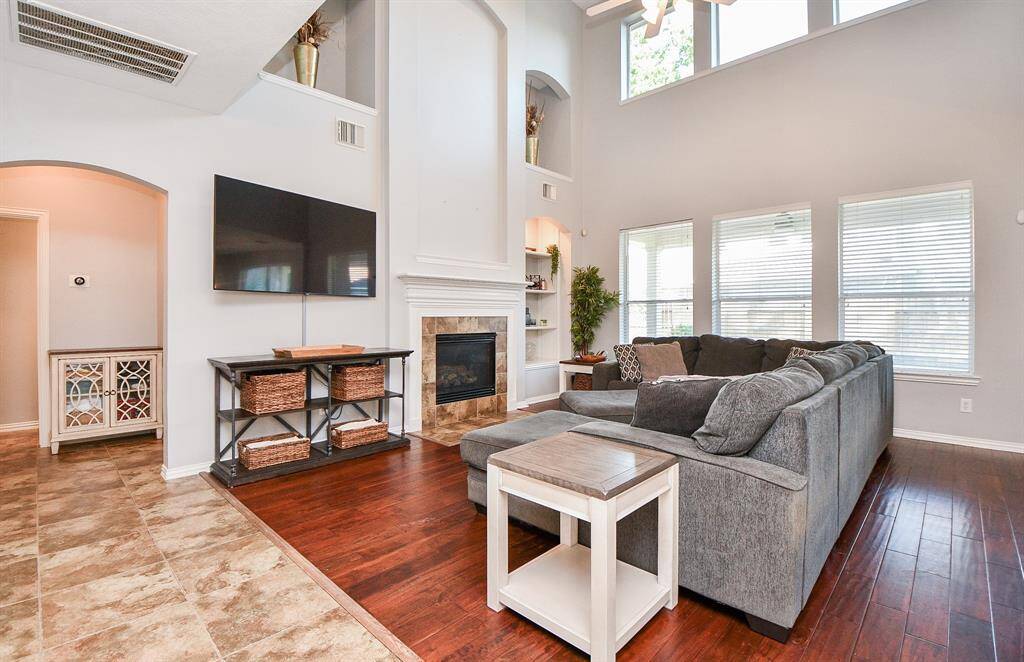 Spacious first-floor living room with soaring ceilings and abundant natural light.