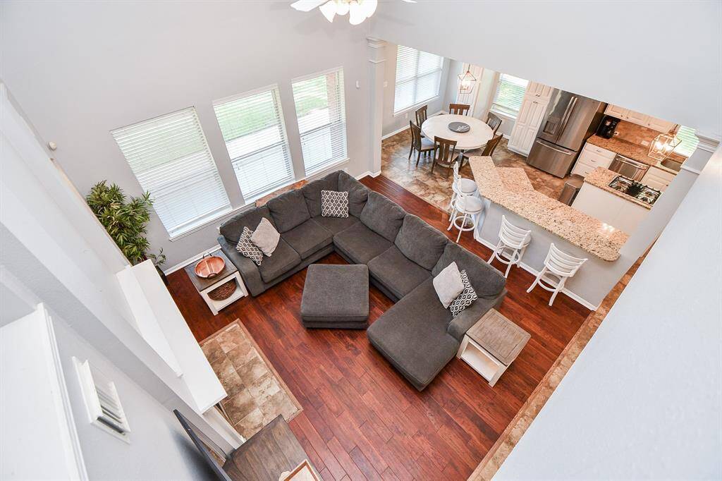 Bright and open first-floor layout with a cozy living area and modern kitchen, perfect for entertaining.