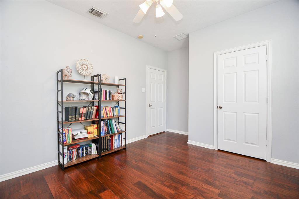 Charming first-floor room with elegant wood flooring.