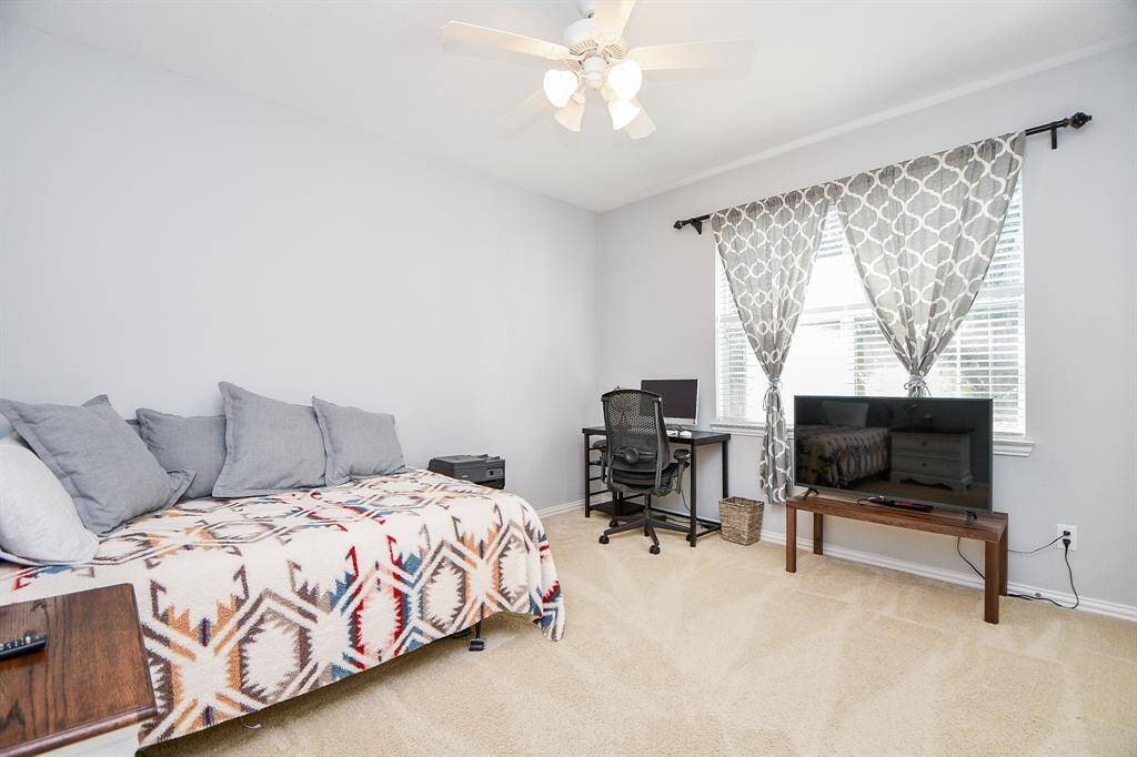 Upstairs, discover the versatile fifth bedroom, perfect for guests or a home office.