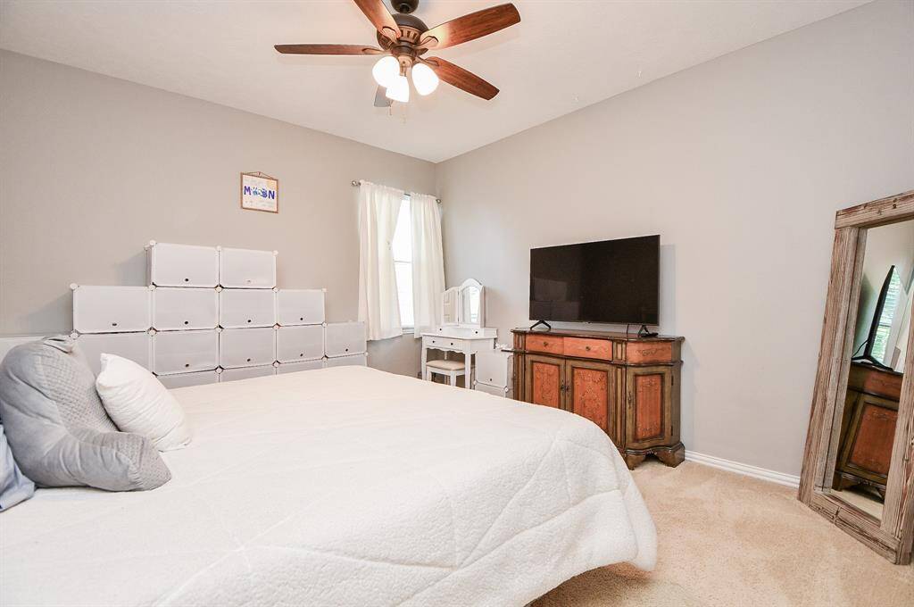 Expansive upstairs sixth bedroom perfect for guests or family.