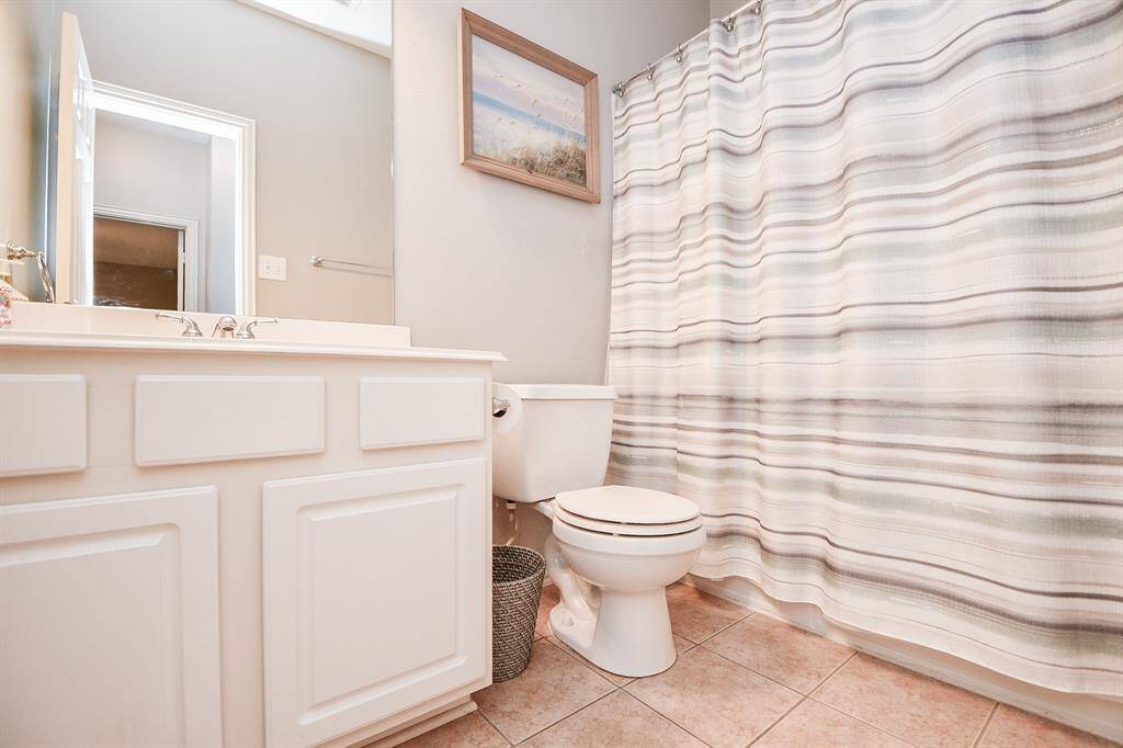 Stylish and convenient upstairs bathroom.