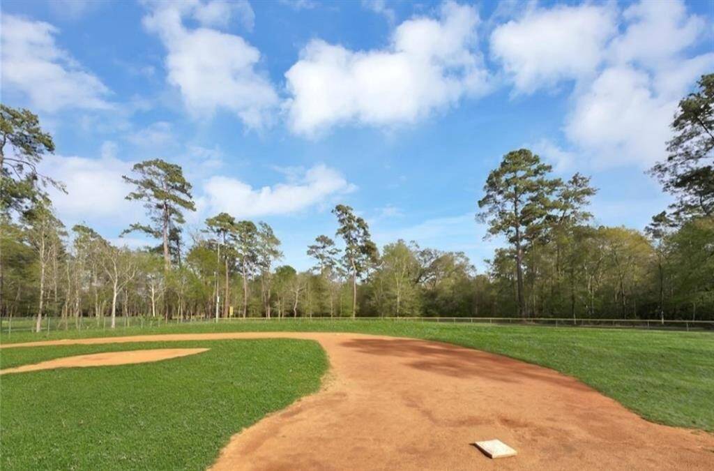 Experience the serene beauty of Fall Creek Golf Course, nestled amidst lush greenery and open skies, perfect for golf enthusiasts and nature lovers alike.