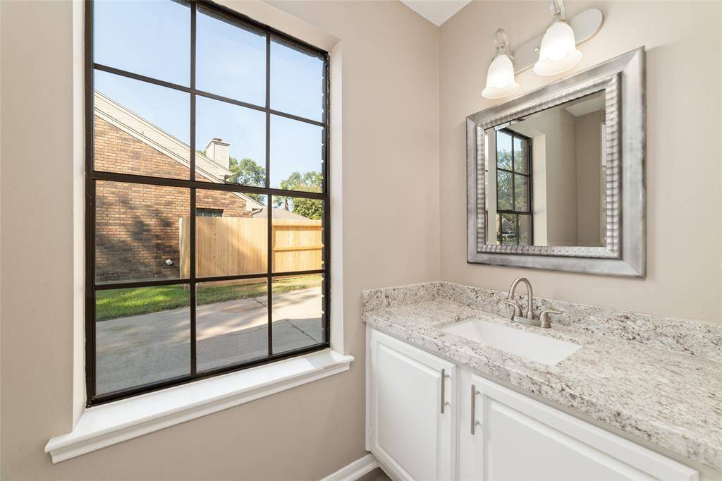 An elegant downstairs powder room for guests.