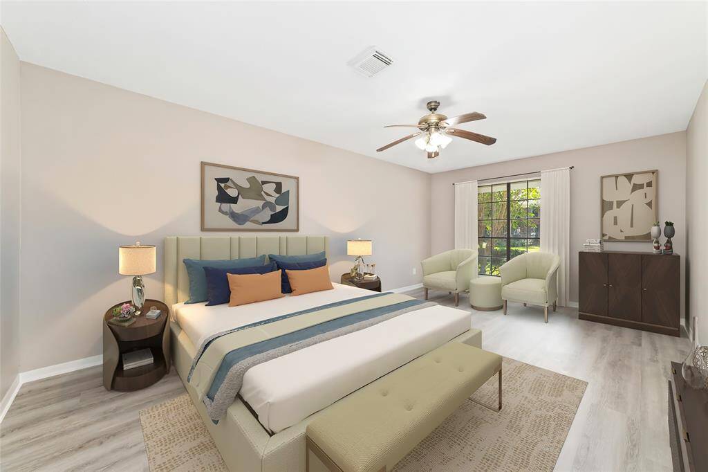 The downstairs primary bedroom suite is the perfect mix of comfort and function with ample room for a full set of king-sized bedroom furniture, a serene ensuite bathroom, walk-in closet, and window for natural light. Virtually staged.