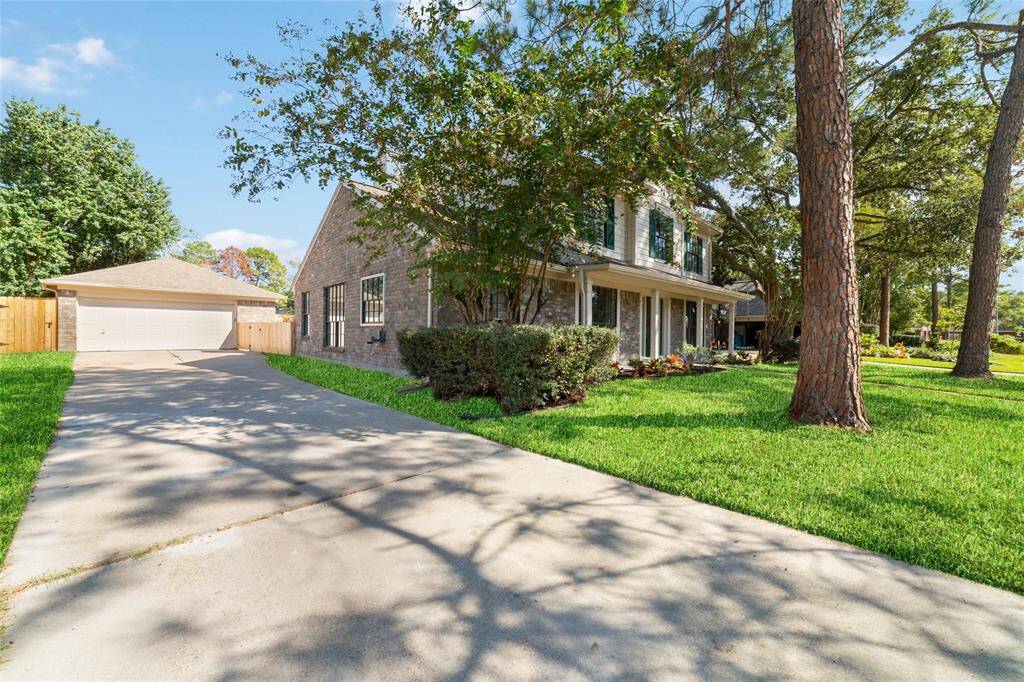 The property boasts an abundance of off-street parking with a two-car detached garage and lengthy driveway.