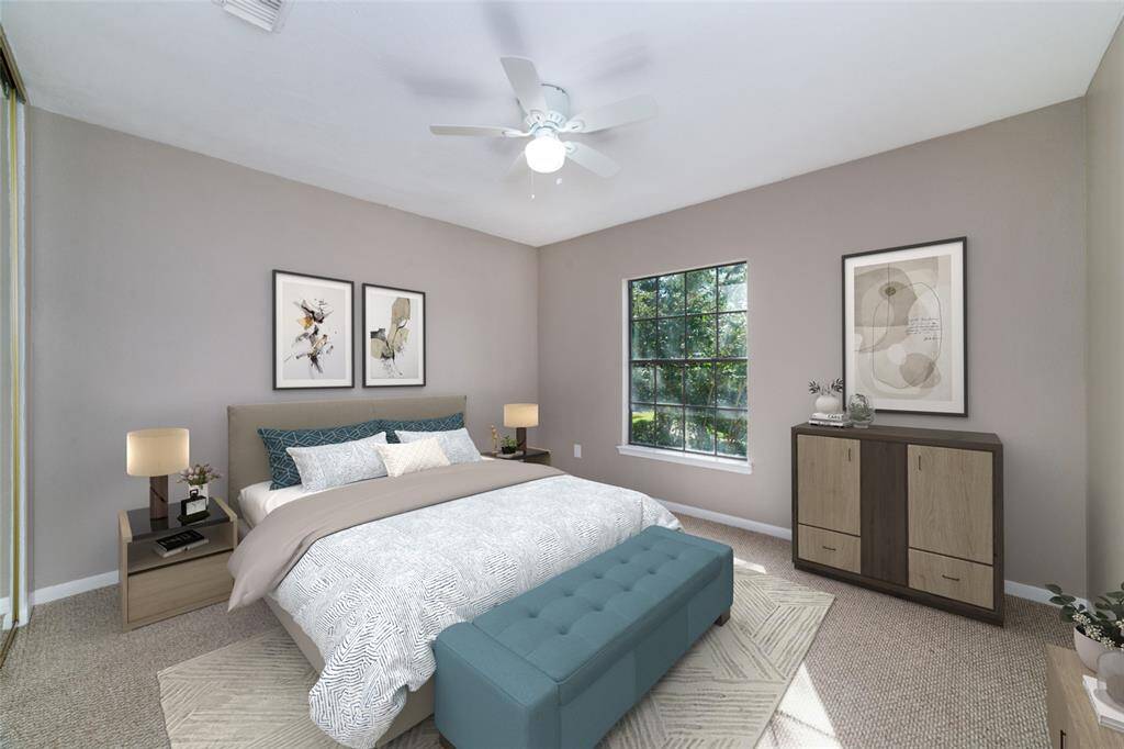 Another secondary bedroom for guests to stay in comfort or easily converted into a dedicated office space. Virtually staged.