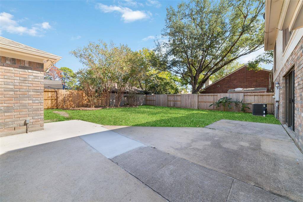An abundance of poured concrete patio gives you ample space for al fresco dining and entertaining.