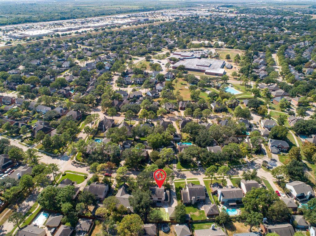 Ault Elementary School and a neighborhood pool, playground, sand volleyball court, and greenspace are only a few blocks away from 15414 Freestone Peach Lane.
