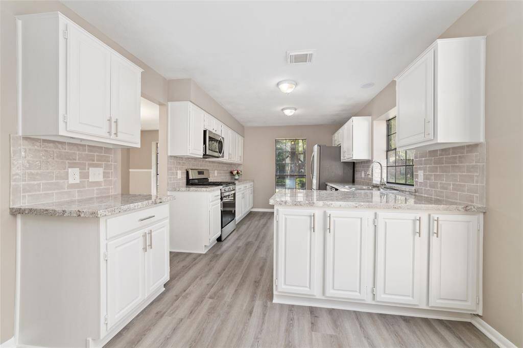 The gourmet kitchen is thoughtfully designed with an abundance of counter space, ample storage, efficient traffic pattern, and a stand-alone coffee or morning beverage station. An adjacent breakfast nook is perfect for quick, casual meals.