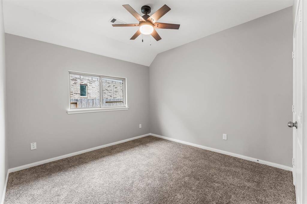 Spacious full bath with granite countertop, large mirror, abundant light, and a private shower/tub room