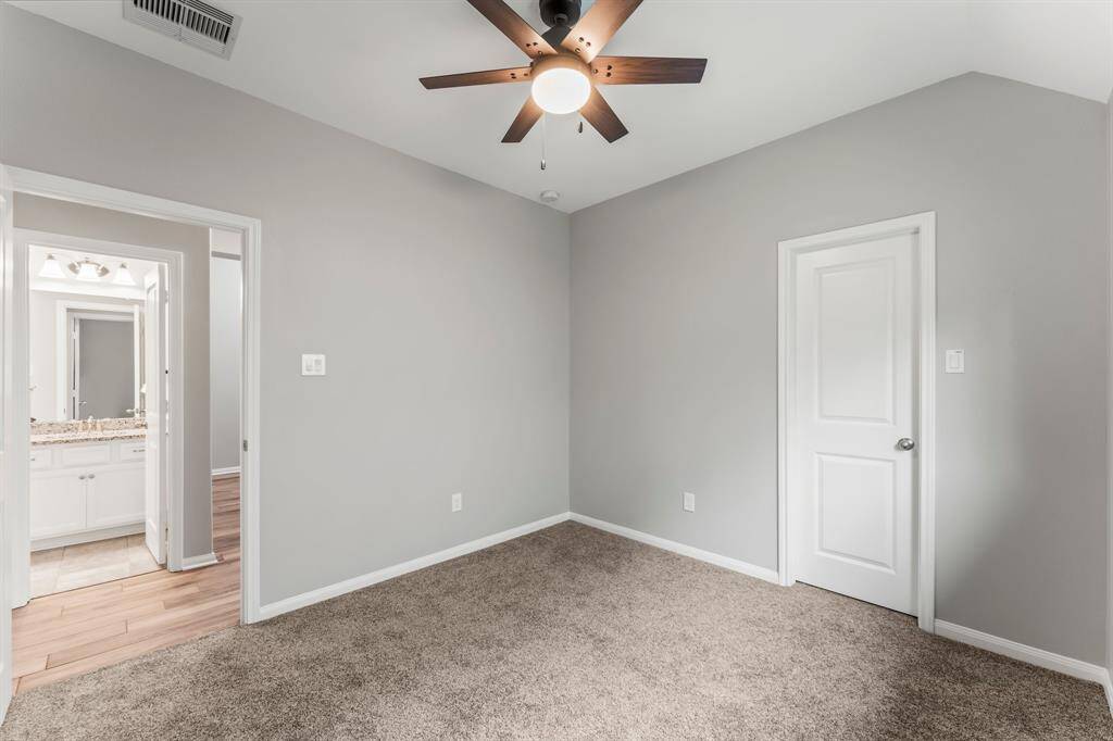 Beside the front room is a secondary bedroom with its own walk-in closet and recently updated carpet.