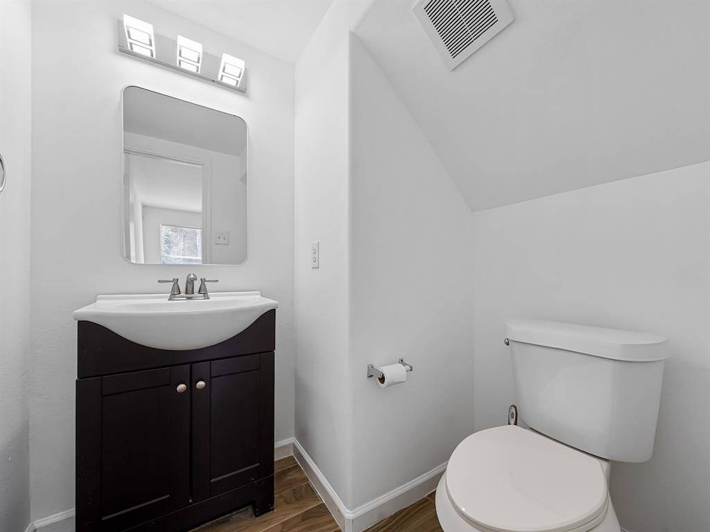 Half bathroom off of the living room is perfect for guests!