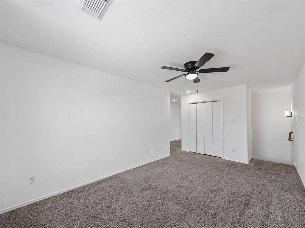 Upstairs, you are greeted with spacious game room that could be used for a variety of purposes. The carpet has been steamed cleaned!