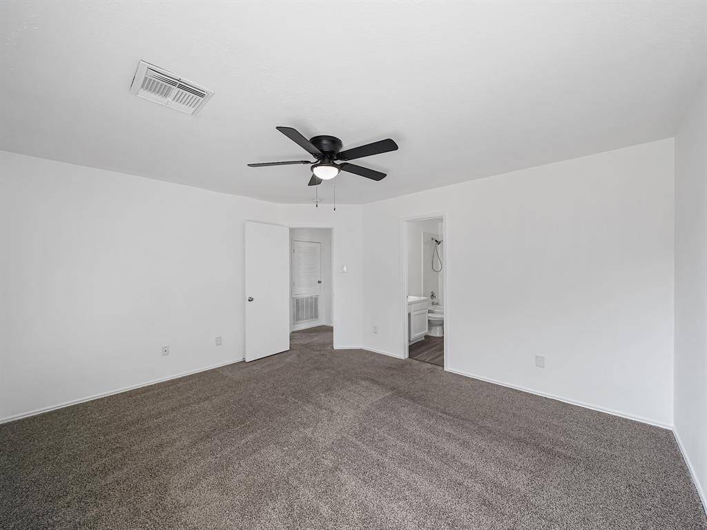 The primary retreat is a true sanctuary, featuring an ensuite bathroom designed for relaxation and convenience.