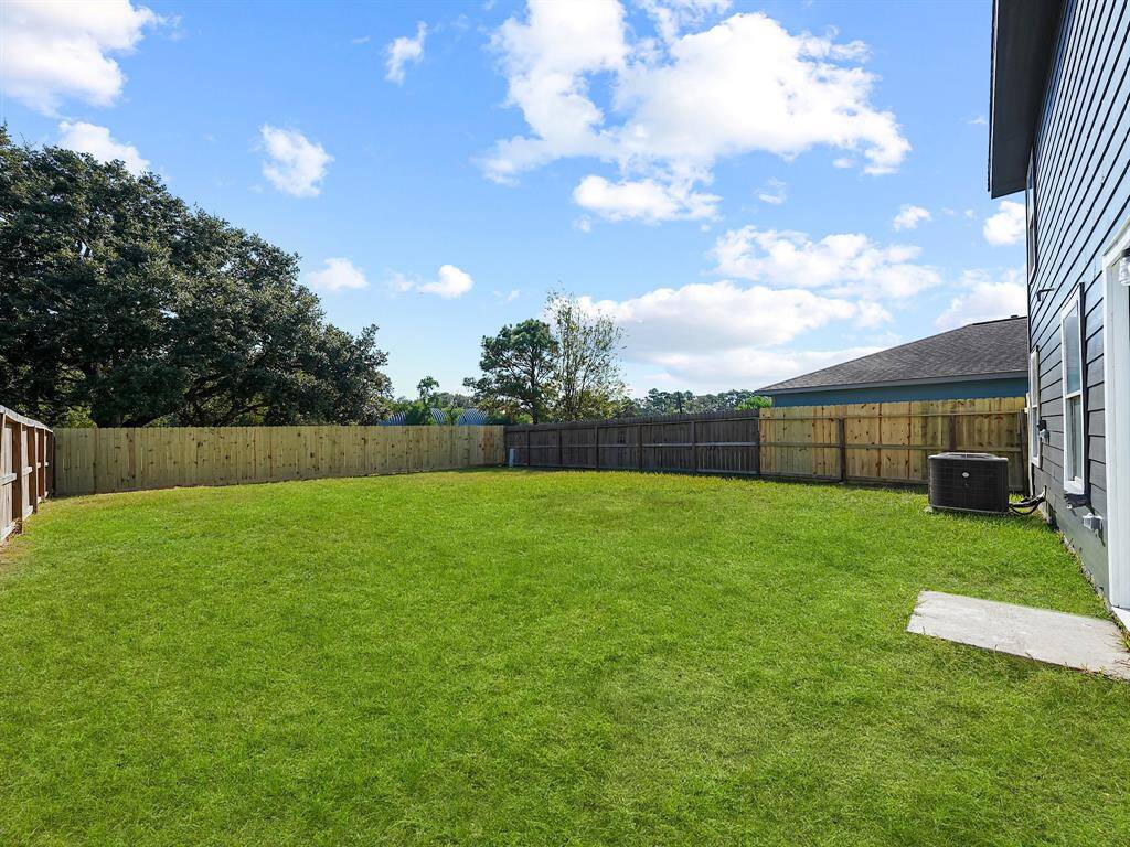 Step outside to discover a huge backyard, a blank canvas ready for your personal touch. It's the perfect space for outdoor fun, whether you're hosting summer barbecues, creating a vibrant garden, or simply enjoying the tranquility of nature. Two sections of the fence have recently been replaced!