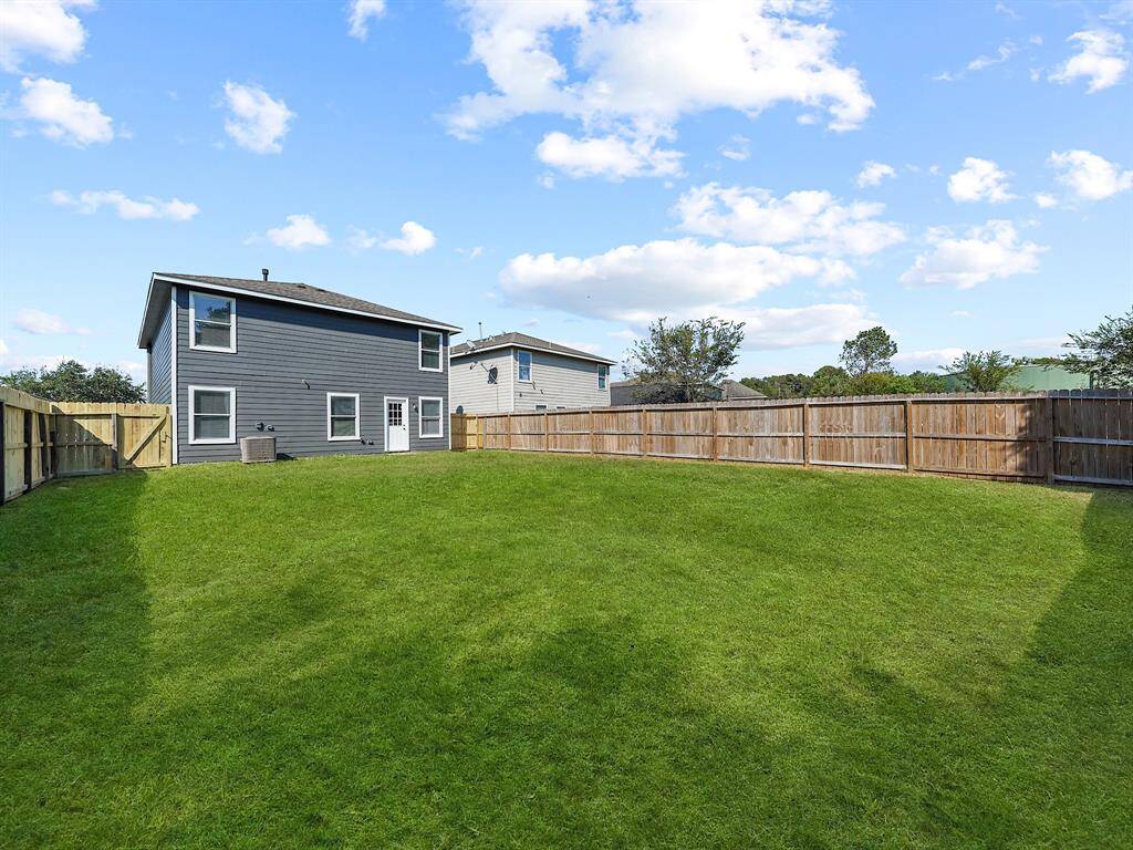 The expansive yard offers endless possibilities for relaxation and recreation, making it an ideal setting for both entertaining and unwinding.