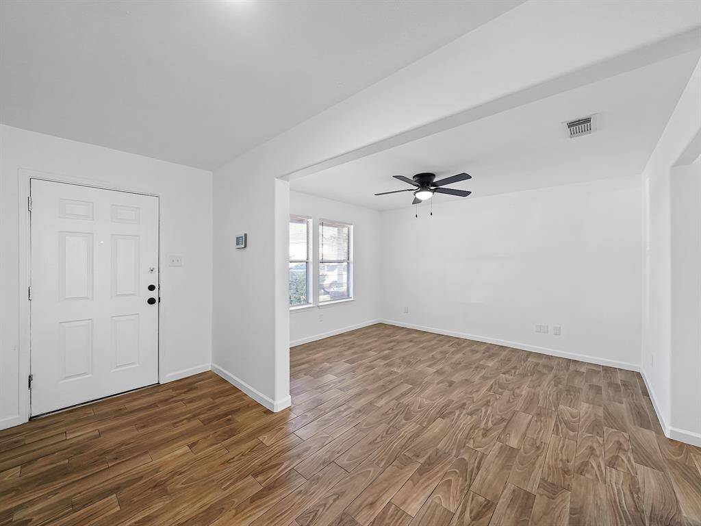 To your left, you'll discover a spacious formal dining room, perfectly designed to host family gatherings and dinner parties. This elegant space sets the stage for memorable moments and celebrations, ensuring that your home is the heart of every occasion.