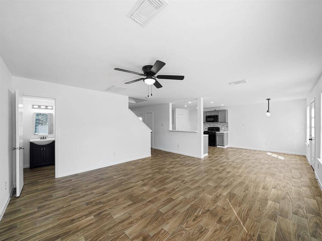 Seamlessly connecting to the bright breakfast nook and modern kitchen, this open layout ensures effortless flow and functionality.