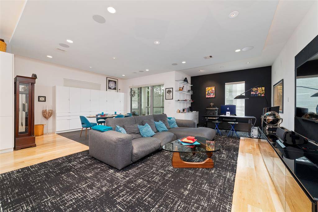 Huge open floor plan with ¾” hardwood floors on the 2nd and 3rd levels. No lack of storage with these built-in shelves and wall cabinets.