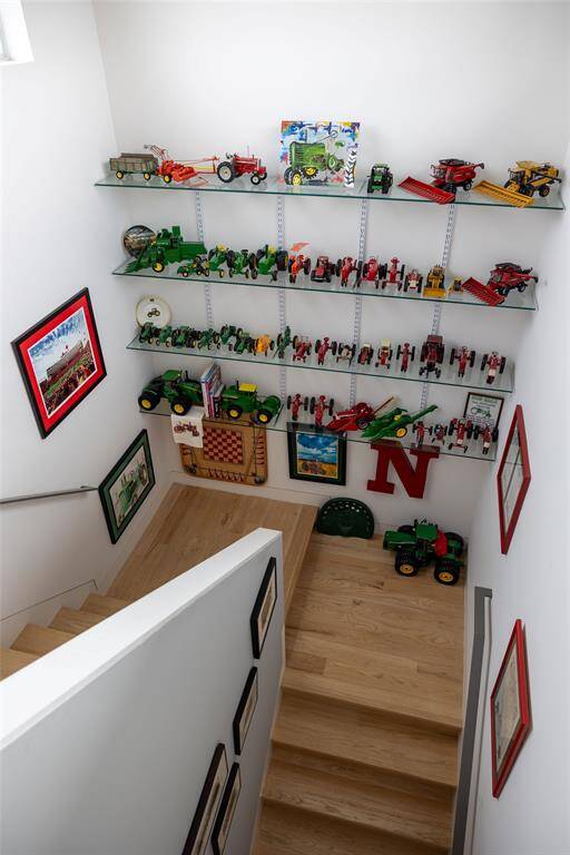 Ample glass shelving to store your collectibles. These stairs lead to the 4th level Sky Deck.