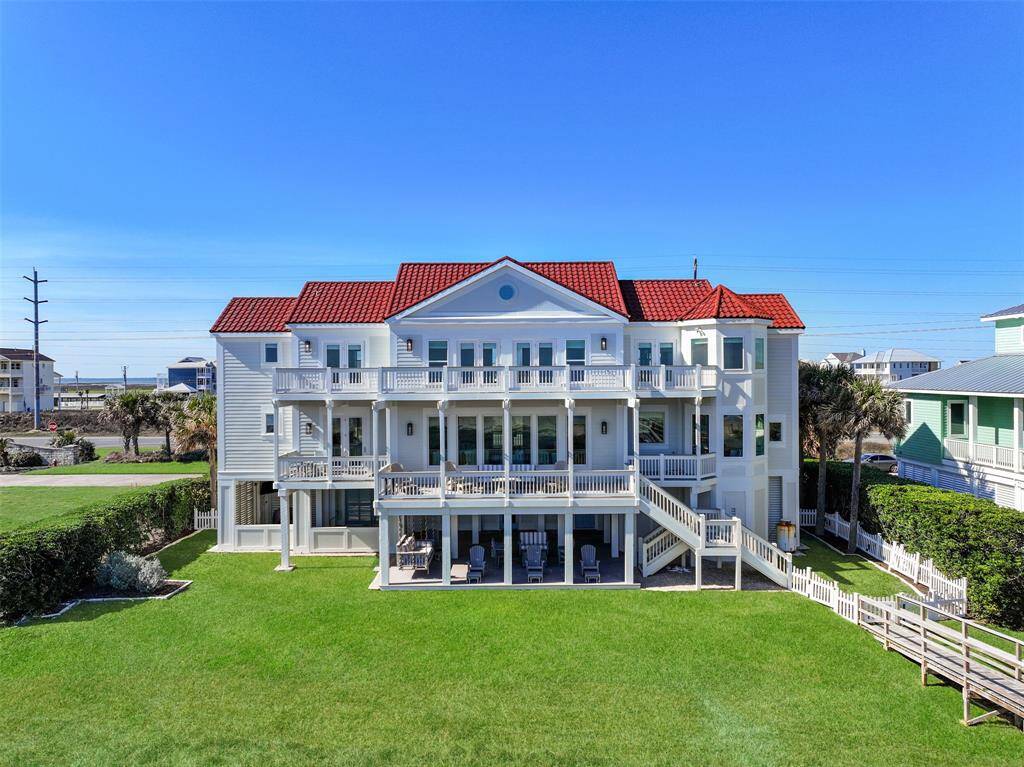 Aerial view of back of home and backyard