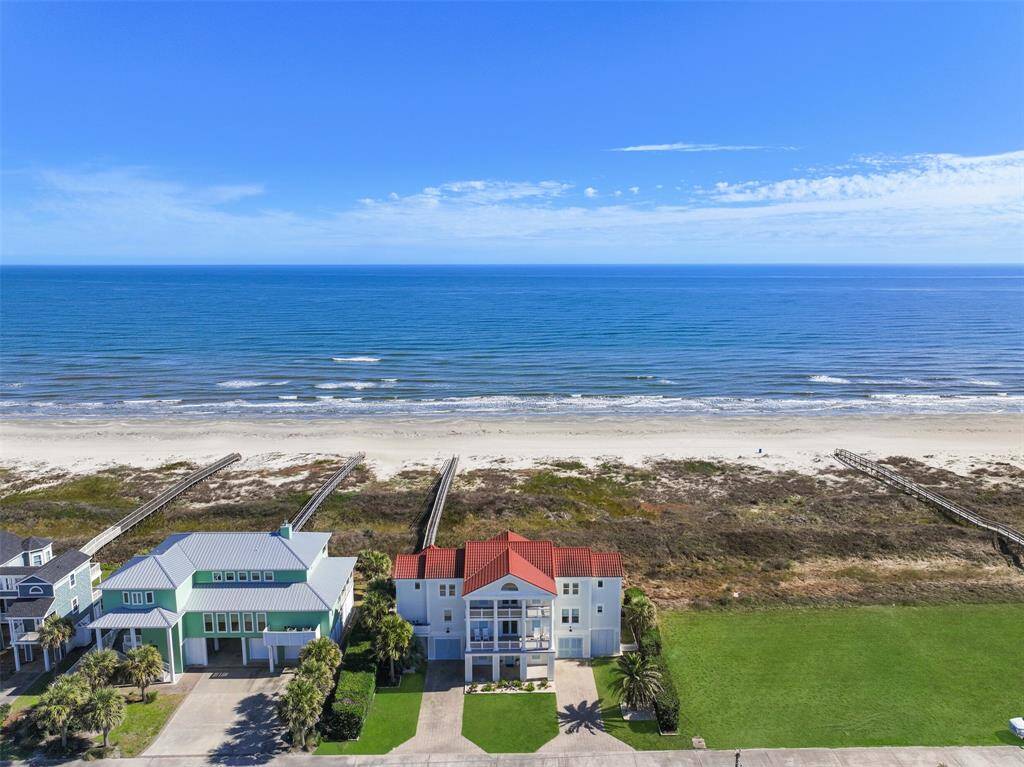 Aerial view of home showing walkover and beach