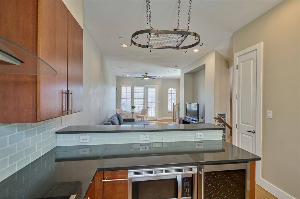 The kitchen even has a wine cooler fridge.