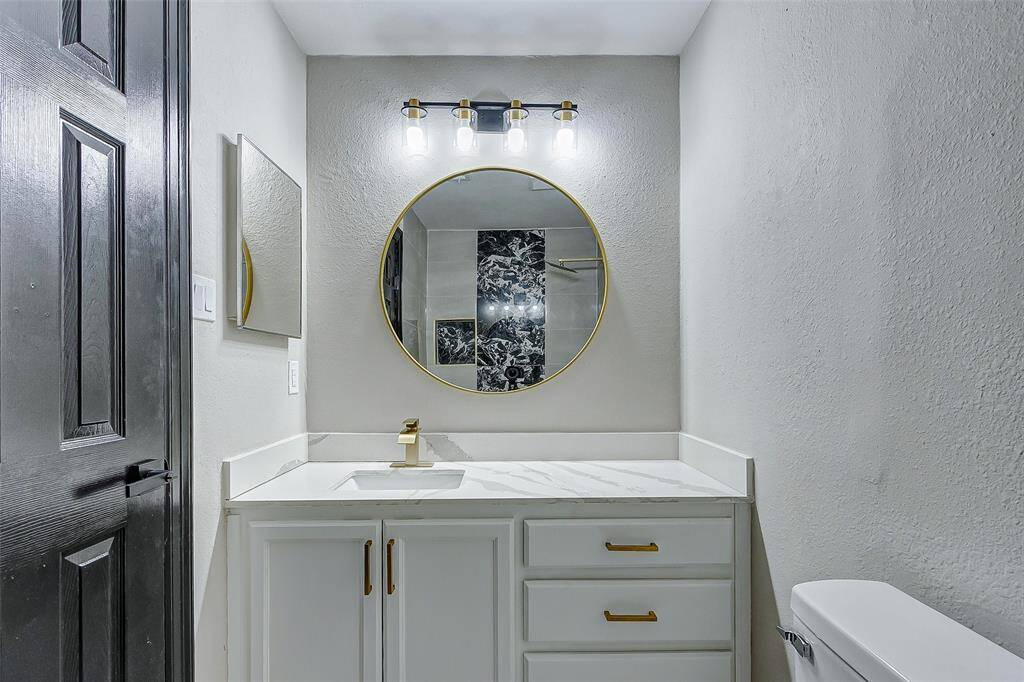 Beautiful Modern Bathrooms with gold modern fixtures.