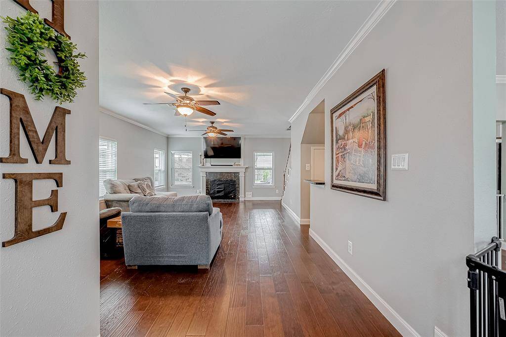 Step off the landing into the living room where you will be welcomed into the heart of the home.
