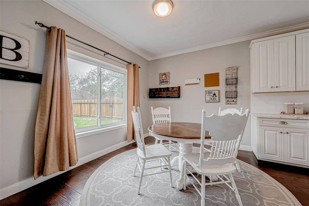 Enjoy your meals and gatherings around your own table as you look out onto the expansive back yard and pool.
