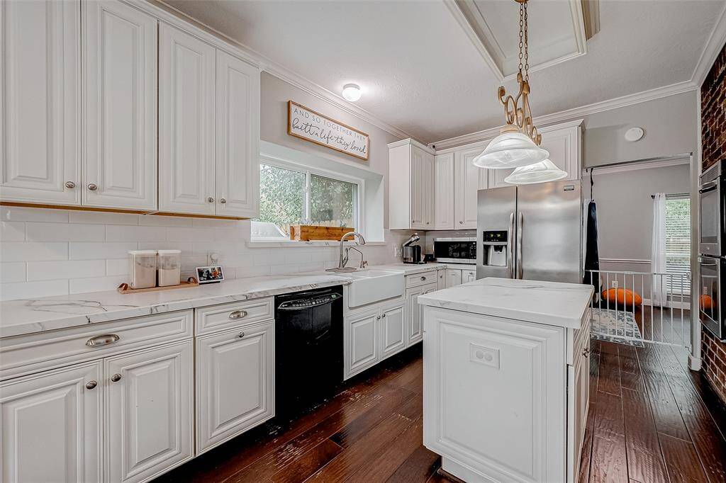 Miles of durable Dekton countertops, wonderful storage, and bright light make this a chef's dream.