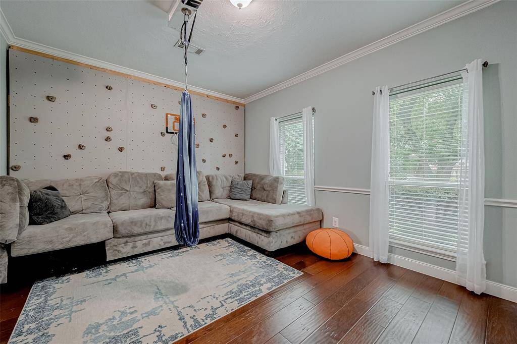 The front room of this home converted to a game room & located downstairs for all of your fun, tv, gaming and other actitivies.