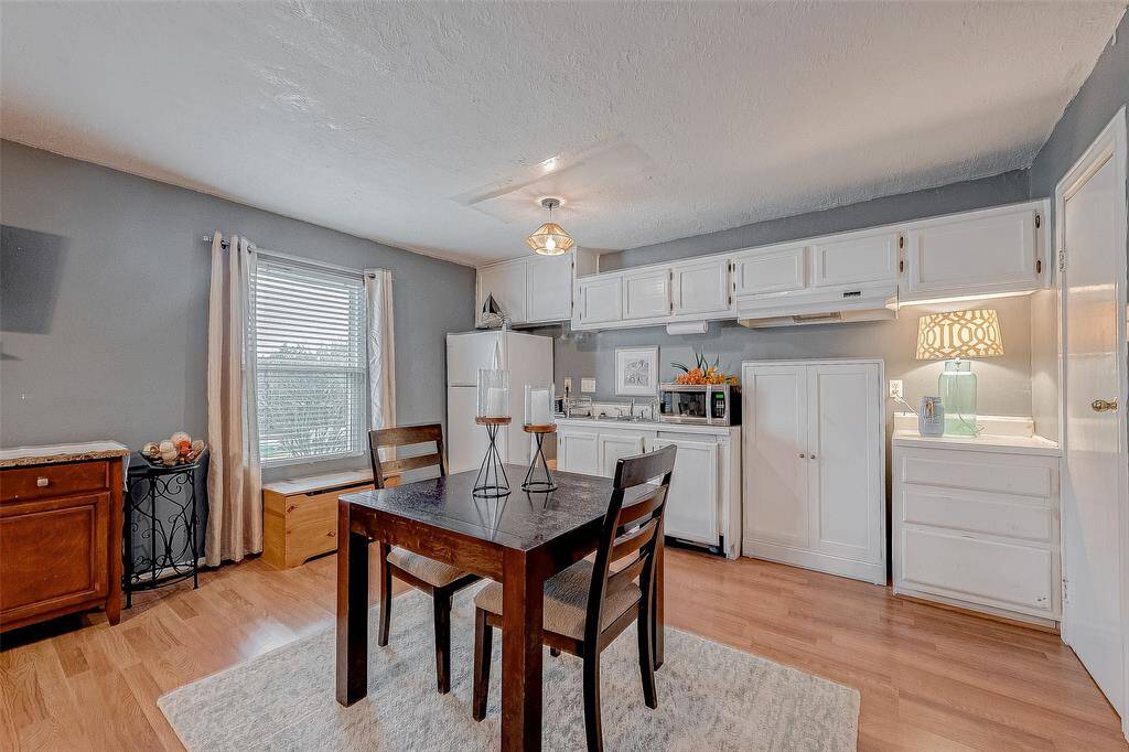 Full kitchen with space for the refrigerator and stove brings another dimension to utilizing this space as an entire living area.