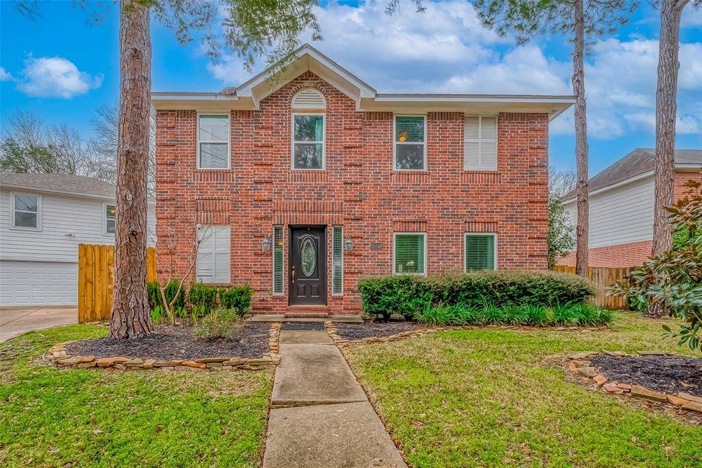 Stately elevation of 21670 Highland Knolls showcases 2214 sf Main House.