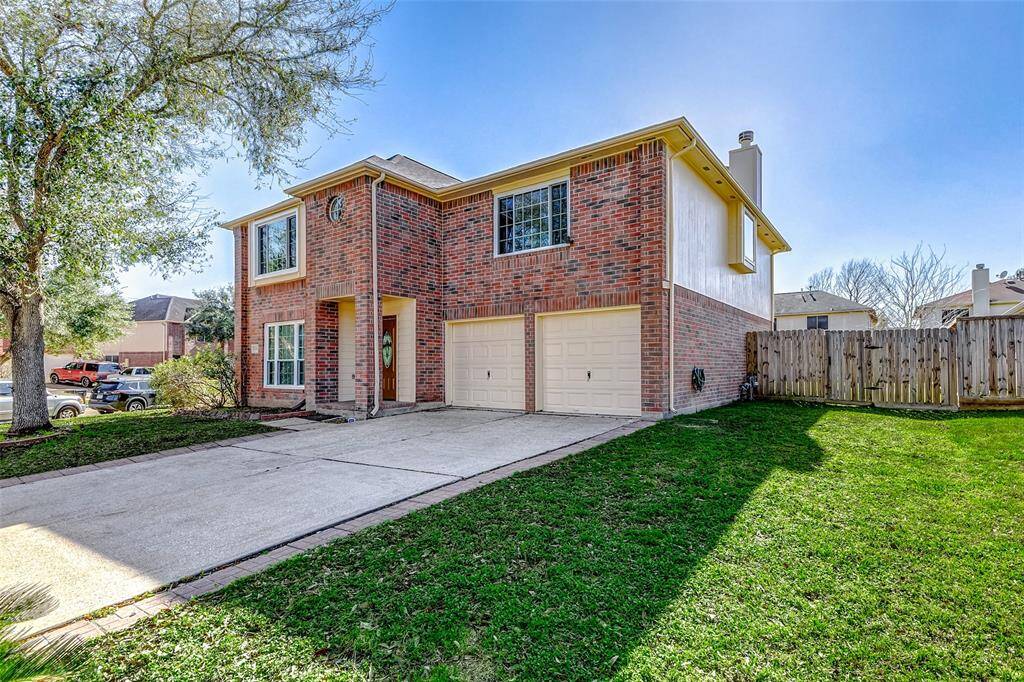double driveway with attached 2 car garage