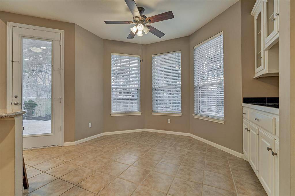 Breakfast area with bay window to enjoy peaceful views of the back yard.