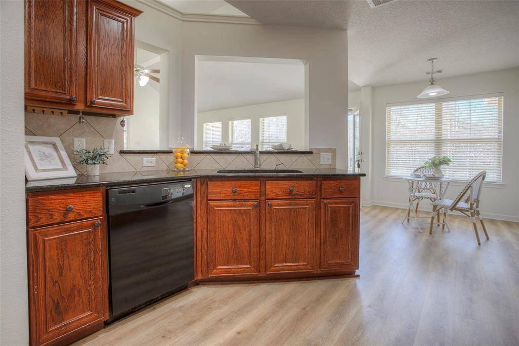 Sink overlooking breakfast bar into the living room from the kitchen