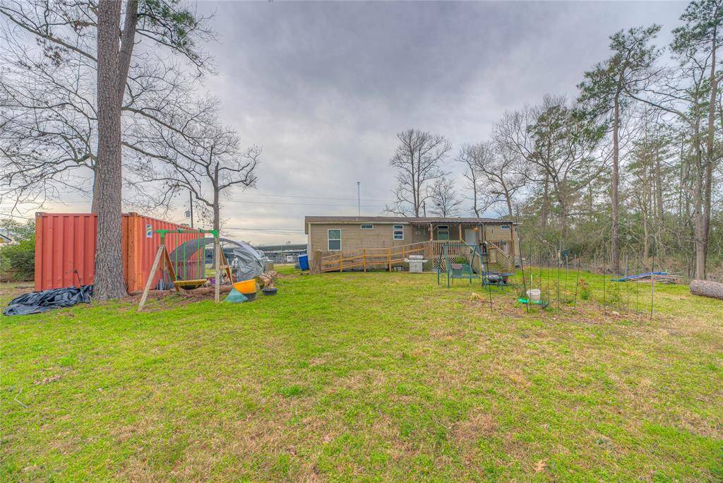 This is the back of the home. Container and the chicken coop will be staying.