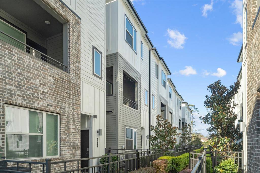 Alternate angle of home, featuring separate entry for third bedroom suite on first floor allowing for possible income rental.