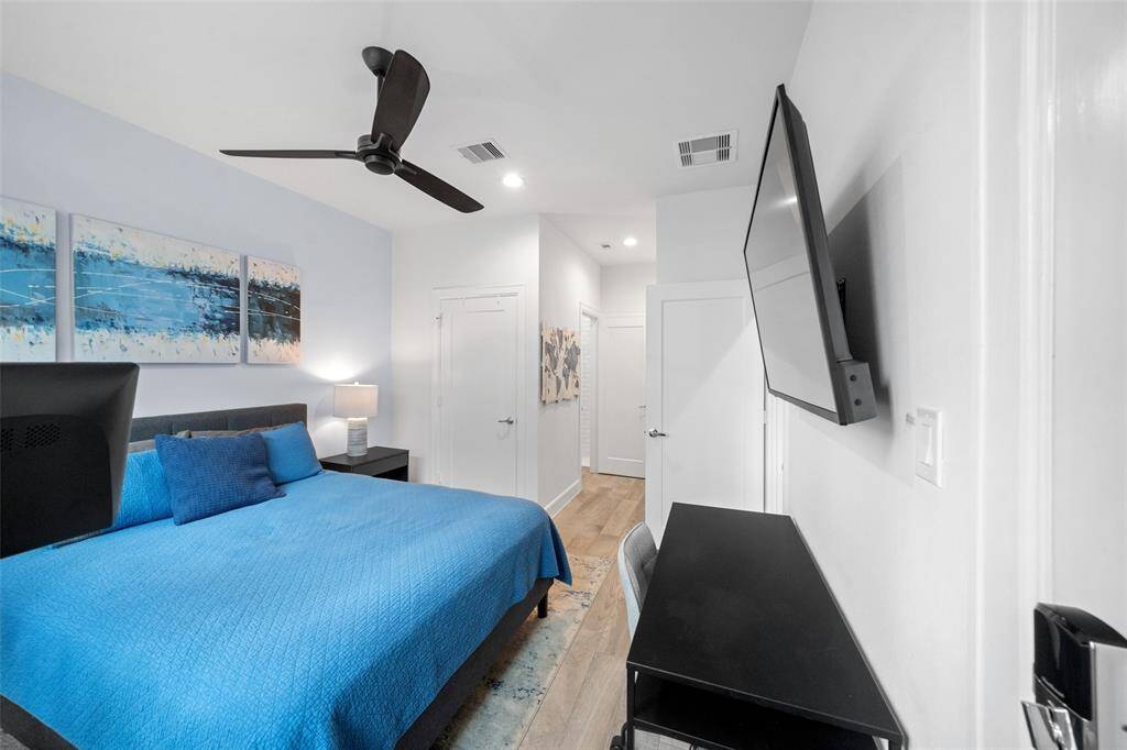 Alternate view of First floor bedroom, featuring closet and kitchenette.