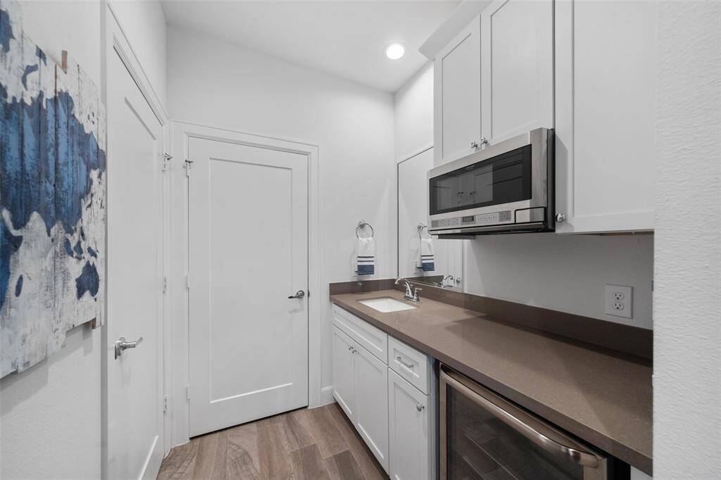 Kitchenette, featuring wine refrigerator and microwave.