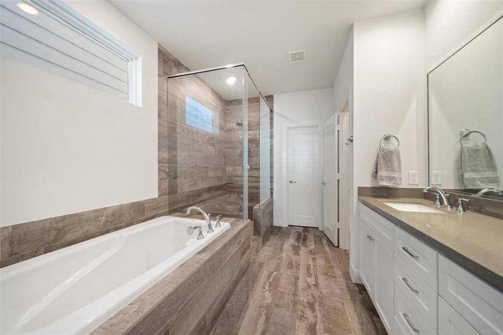 Lavish Soaking tub and walk-in shower.