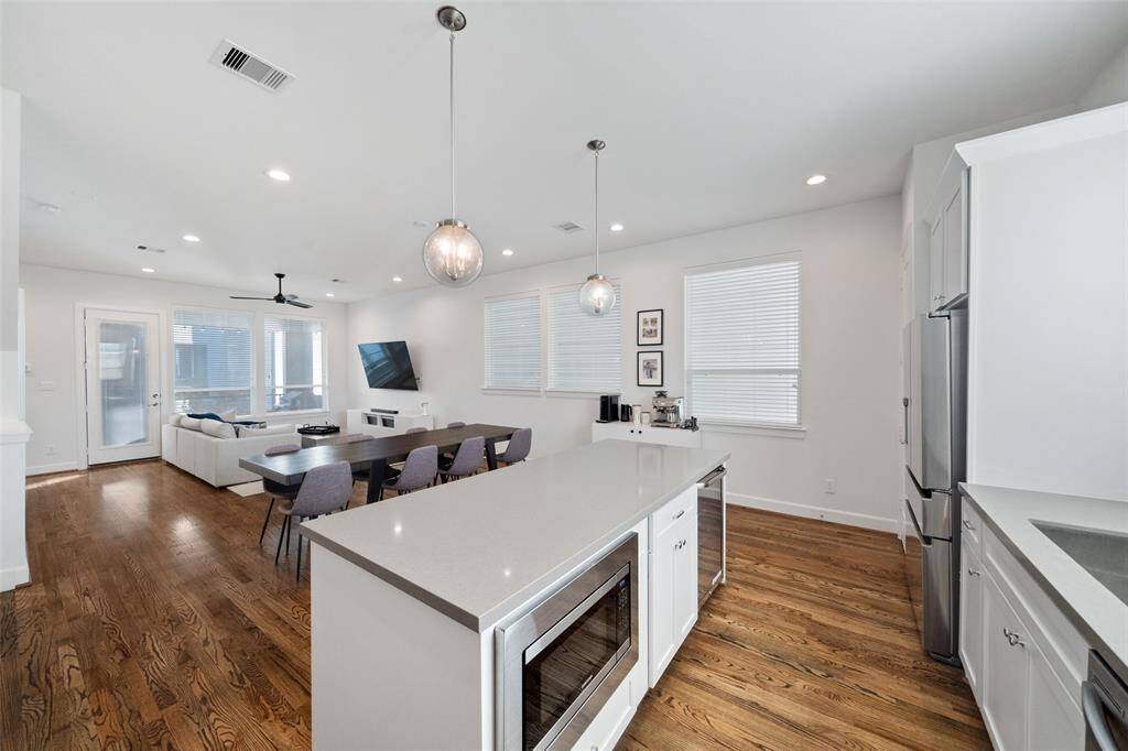 Kitchen Island features built in microwave.
